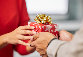 Christmas gift, office and hands of couple of friends and workers with present and box. Holiday,...