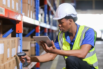 Male american african factory company employee scanning box checking number of products on goods...