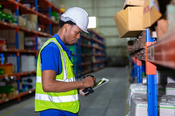 Male american african factory company employee scanning box checking number of products on goods...