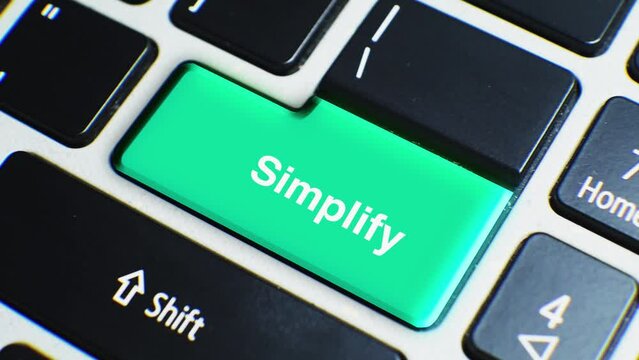 Laptop Keyboard Close Up and Finger Press Simplify Word or Text Button Key