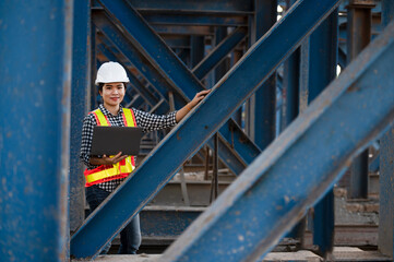 construction engineer Asian female architect with tablet computer at expressway construction site young woman watching expressway construction site