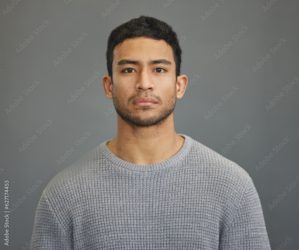 Wall mural Serious man, casual style and portrait with modern fashion in a studio. Male model, grey background and young person from Philippines of a handsome Asian adult with confidence, attitude and jersey