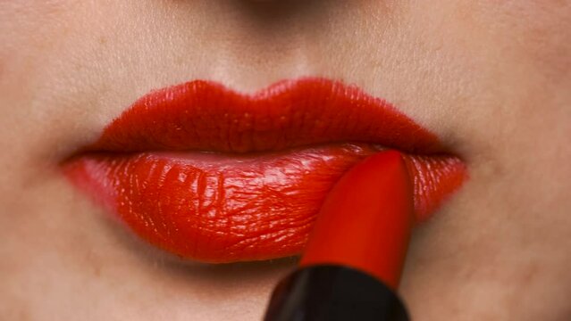 Pretty Woman Applying Red Lipstick on Her Lips. Preparing for Romantic Night in Beauty Saloon. Close Up Shot of Lips. Makeup Tutorial for Social Media Platforms. Slow Motion 4K Prores 422