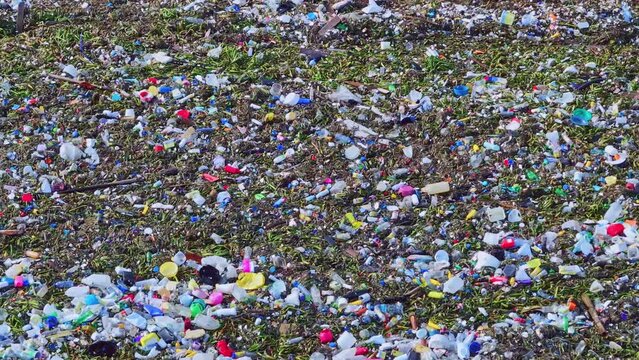 Ocean waves full of plastic trash, close-up sea pollution, world catastrophe