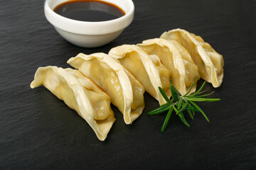 Gyoza Chinese Dumplings, Fried Vegetable Jiaozi, Chicken Momo Pile, Asian Gyoza Group on Black...