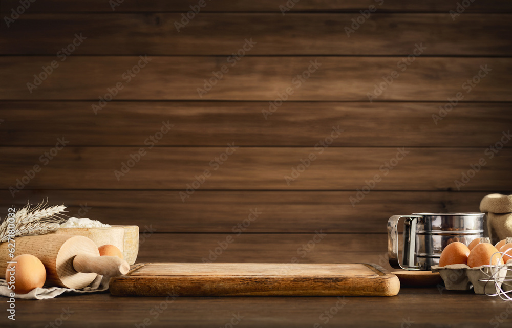 Poster wooden table with various ingredients for dough cooking with space for your product or text