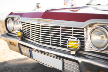 close-up of a retro car with front headlights