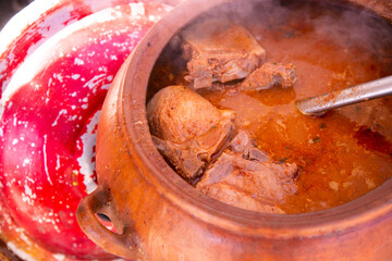 The Adobo de Chancho arequipeño consists of a marinated pork meat dish that is accompanied by...