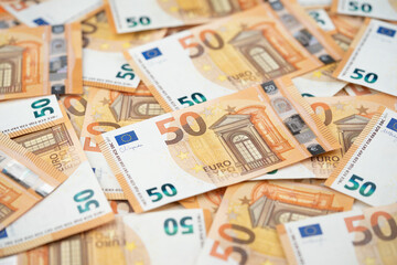 many 50 euro bills close-up mixed haphazardly