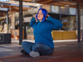 blue hair woman listening music