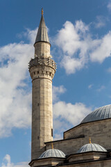Fototapeta na wymiar Minaret of the Firuz Aga Mosque (Firuz Aga Cami), Ottoman mosque, Vertical shot. Fatih district of Istanbul, Turkey (Turkiye)