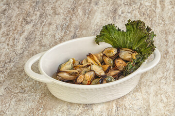 Tasty marinated mussels in the bowl