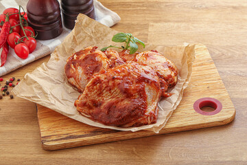 Marinated chicken leg in tomato sauce