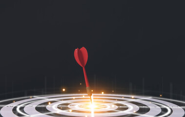 red dart aiming precisely at the center of the target board.	

