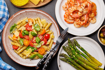 Italian pasta adorned with fresh tomatoes and aromatic basil