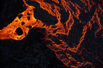 Aerial view of spreading melted lava from volcano.