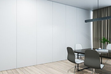 Fototapeta premium Closeup view of blank white wall with place for poster or banner in a modern meeting room with wooden office desk and chairs, mockup. 3D Rendering