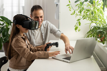 Portrait of enjoy happy love asian family father and little girls child smiling and having fun using glasses of technology virtual reality headset. concept of modern VR metaverse technologies