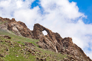Fototapeta na wymiar Rock with a hole. Rocky Mountains