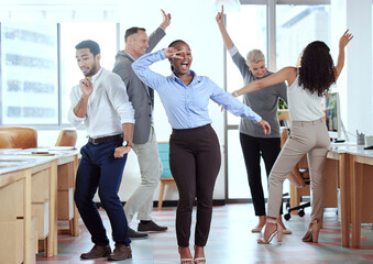Office, celebration and excited business people dance for success, achievement and team building. Corporate, collaboration and happy men and women dancing in workplace to celebrate bonus or profit