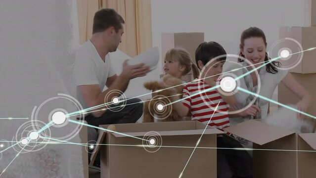 Animation of network of connections with icons and caucasian family unpacking boxes