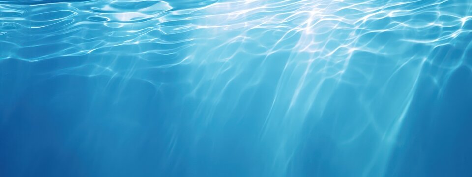 An original beautiful background image for creative work or design in the form of a water surface with chaotic waves and a play of light and shadow.