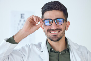 Face, man and optometrist smile with glasses for vision, healthcare or wellness. Portrait, happy...