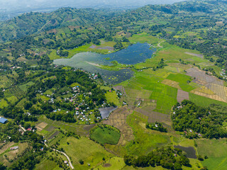Beautiful landscape with agricultural fields around the Lake Seloton with fish farm. Lake Sebu. Mindanao, Philippines.