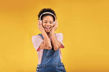 African girl, headphones and studio portrait with smile, youth fashion and sound by yellow...