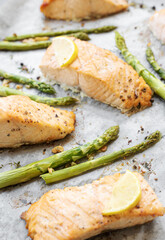 Baked Delicious salmon, green asparagus and lemon in pan