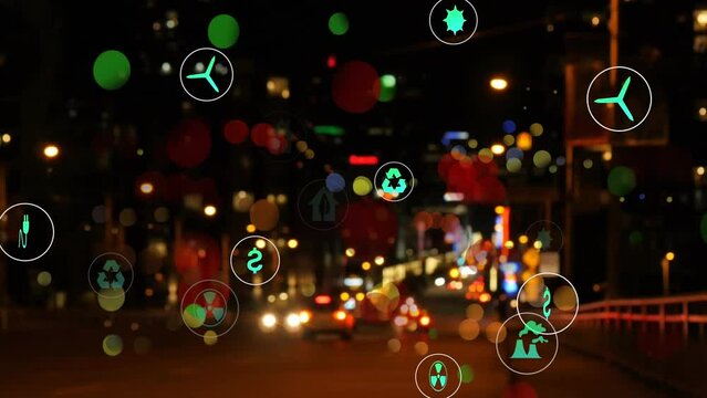 Animation of multiple digital icons and colorful spots against night city traffic