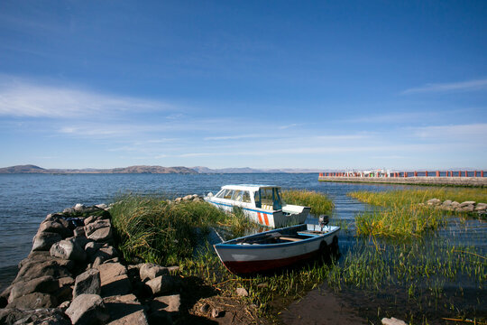 Activity of fishermen and their boats in the Llachón peninsula on Lake Titicaca.