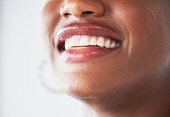 Happy, lips and beauty with a woman closeup in studio on a gray background for makeup or cosmetics....