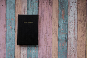 Holy bible on wooden table