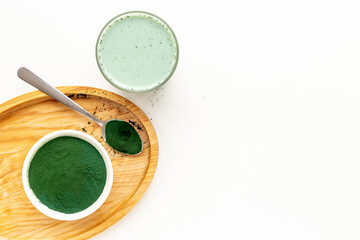Spirulina algae powder and green latte, top view. Super food concept