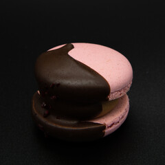 Macaroon on a black background.