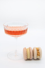 Macaroon and wine on a light background.