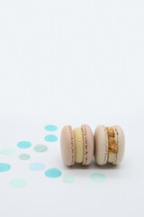 Macaroons with blue dots on a light background.