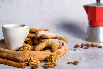 Oriental Algerian sweet cookies, coffee cup and cinnamon stick. Light background