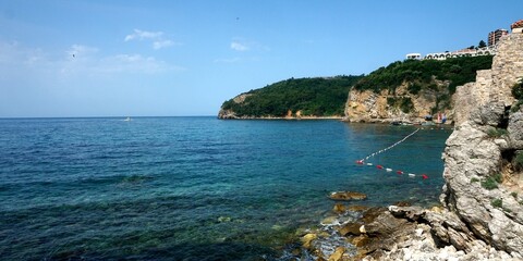 Fototapeta premium Budva, Montenegro - June 25, 2023: View of Budva bay, Adriatic sea from Budva old town, Budva old town, Montenegro.
