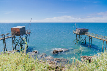 Traditional fishery huts made of wood by the Jade Coast in Pornic, France