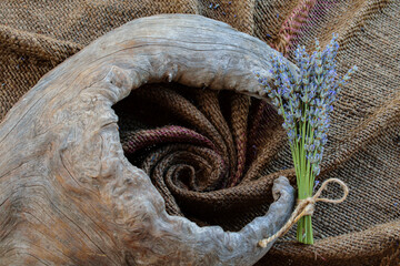Energizing textures with lavender bunches and creative wooden object