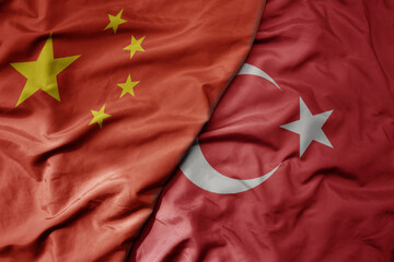 big waving national colorful flag of china and national flag of turkey .