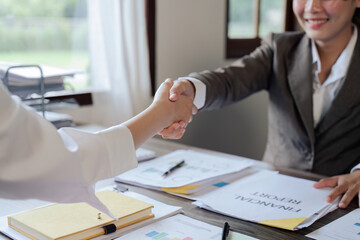 Closeup Handshake of businesspeople and a partner after planning strategy marketing in the office