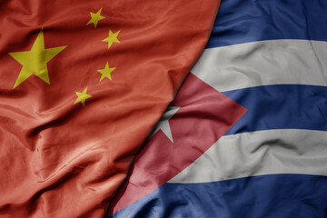 big waving national colorful flag of china and national flag of cuba .