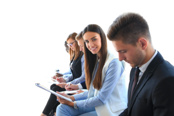 Smiling businesswoman looking at camera at seminar with her colleagues near by on a transparent background