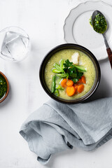Minestrone soup with parsley pesto sauce, vegetable cream soup