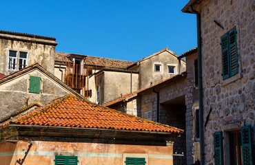 Fototapeta na wymiar street view of the old town of Kotor in Montenegro, medieval European architecture, city streets, red tiled roofs, the concept of traveling across the Balkans