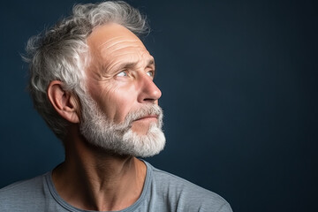 Obraz premium Thoughtful dreamy attractive middle aged man enjoying calm leisure time at home, looking away in deep thoughts with pensive face, dreaming, thinking over good future plans. Generative AI.