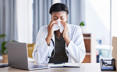 Sick, doctor and a black woman blowing nose in an office as a healthcare employee at a desk. Table, hospital and an African nurse or medical worker sneezing into a tissue with a virus or flu - Powered by Adobe